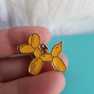 Balloon animal pin.